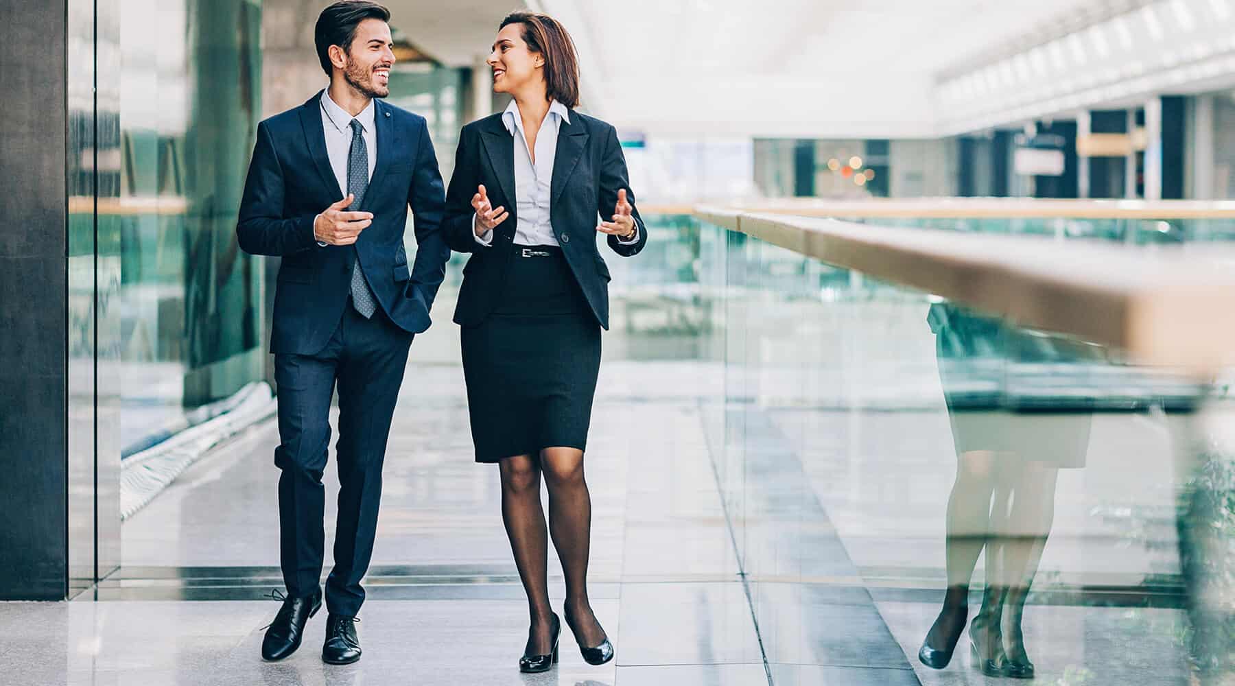 Business Man & Woman Walking