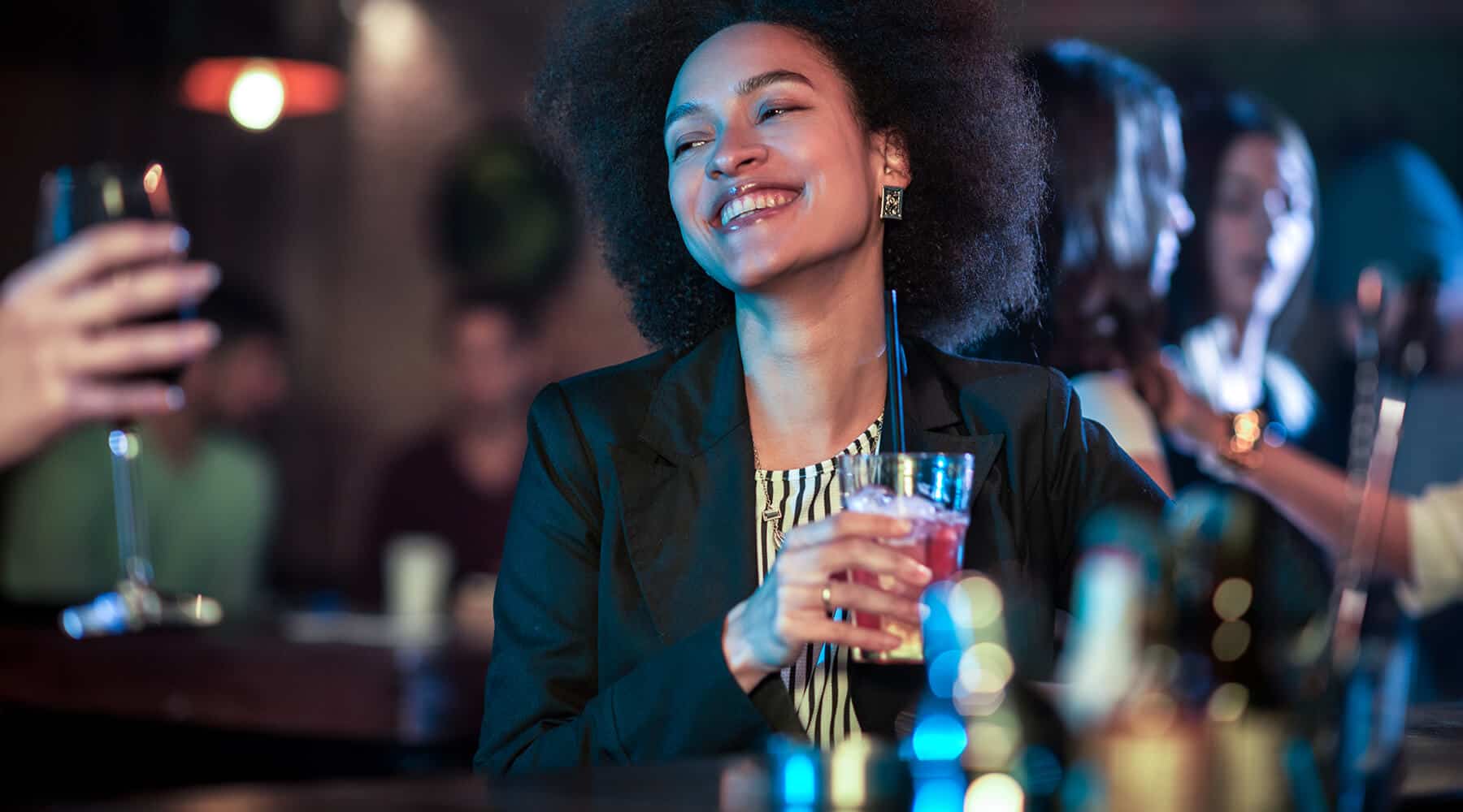 Woman Laughing & Drinking